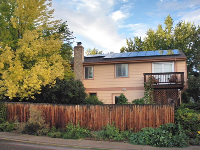 View from Griffith Street showing perennial herb garden and solar panels